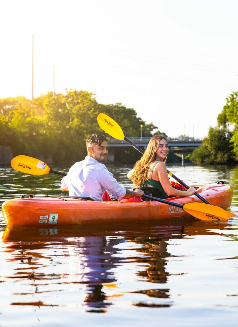 Couple kayaking on their elopement day. Read on to know how to go about building Your Perfect Wedding Timeline.